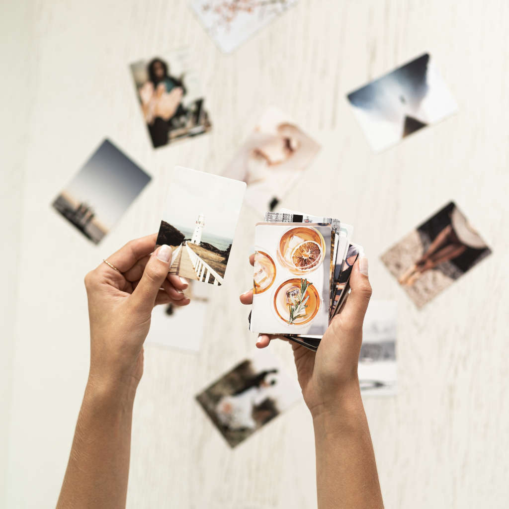 Woman holding visualization cards for vision board