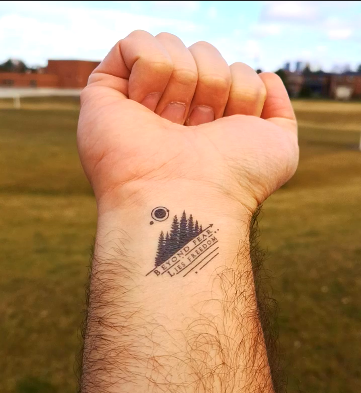 Freedom tattoo on the left inner wrist