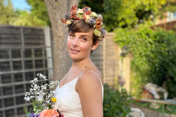 Real bride Amy wears a flower crown to her summer wedding