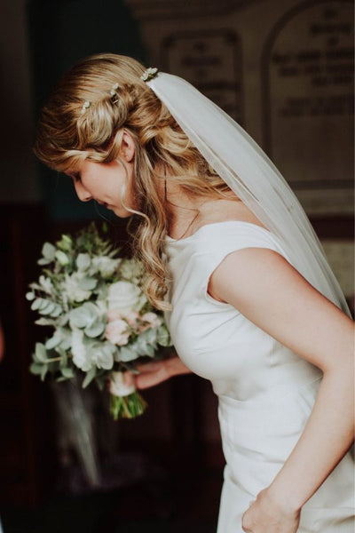 Your hairstyle will make a difference to how you wear your chapel length veil