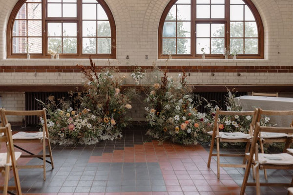 real bride shares her tips - an image of her venue for the ceremony with flowers