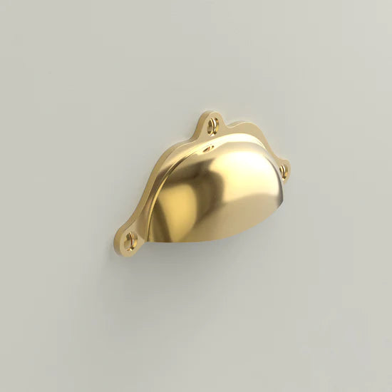 Polished gold cup pull handle with a shiny finish, ideal for modern furniture accents.