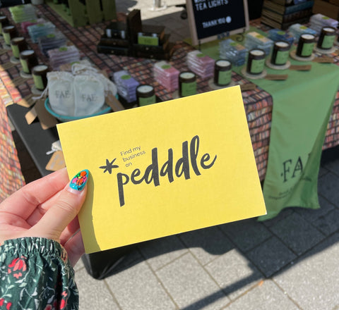 A Pedddle membership board in front of a stall