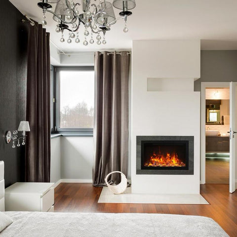 amantii traditional built-in electric fireplace insert installed in a modern luxury bedroom