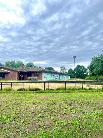 The visitor's centre at Anglers Country Park featuring a colourful mural by Beth Morgan Art