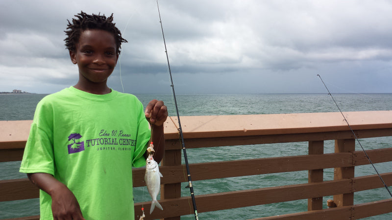 child pier fishing with shark zen