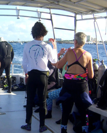 diver on dive boat with dive shirt