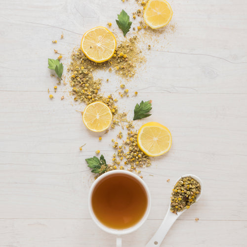 lemon-tea-with-dried-chinese-chrysanthemum-flowers-lemon-slices-wooden-table.jpg