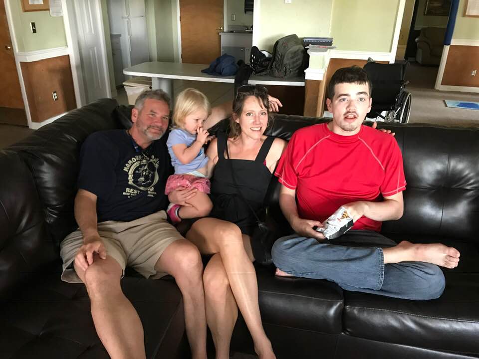 Logan with his father, younger sister, and mother.  From left to right: Glen, Holly, Kristi, Logan.