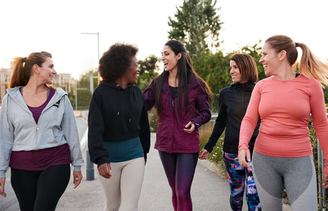 Friends are going for a walk to discuss perimenopause and the findings from the women health initiative study