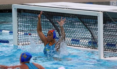 Sami Hill, American water polo goalkeeper in a JOLYN water polo swimsuit