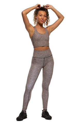 a woman wearing JOLYN sports bra and leggings