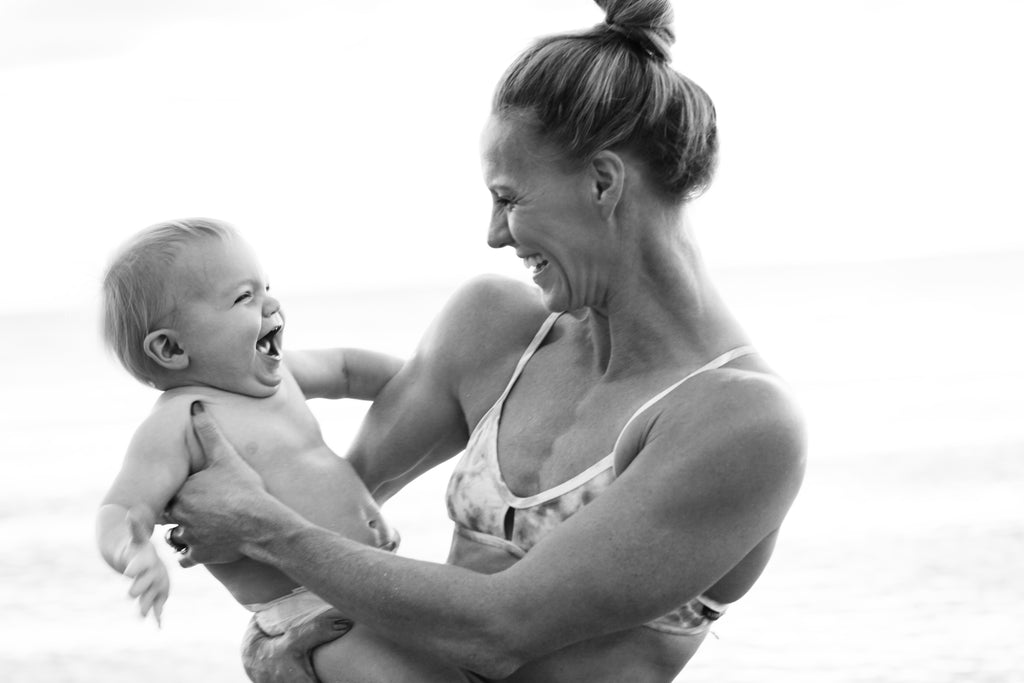 Pan Am Champion Erika Erndl holding her baby