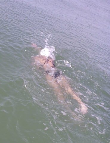 woman surfing wearing a Jolyn surf bikini