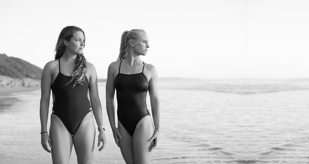 Charger Carter and her friend posing in JOLYN swimsuits