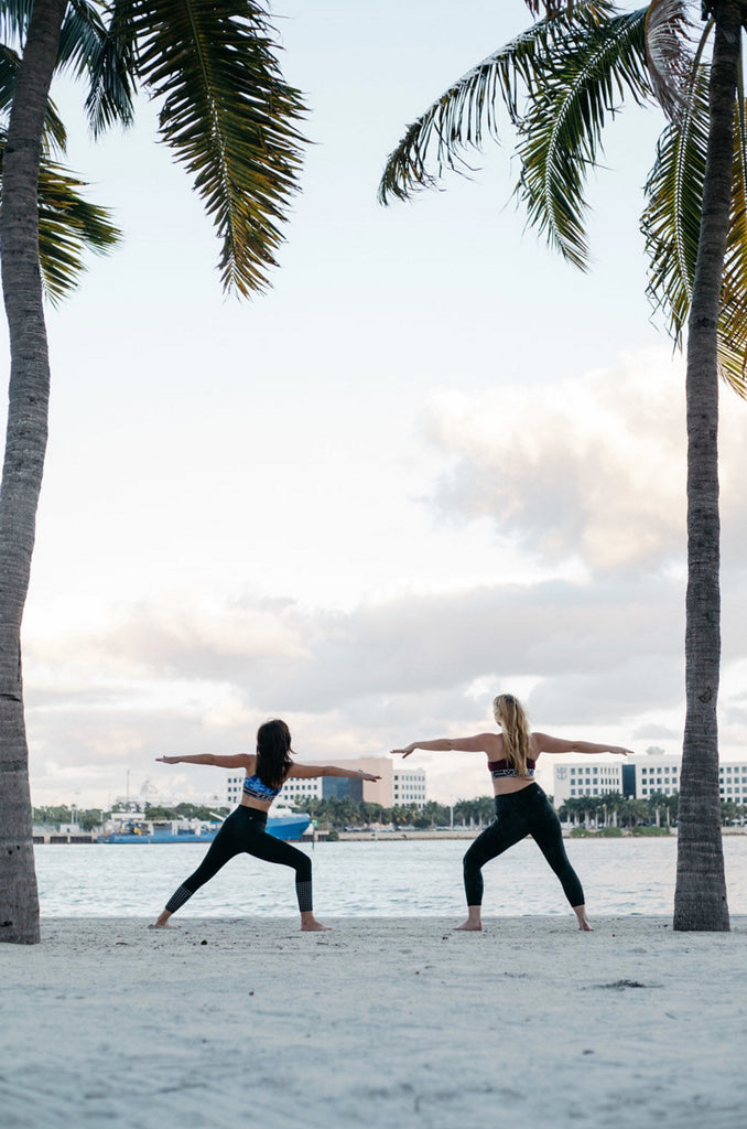 two women wearing JOLYN sports bras and leggings