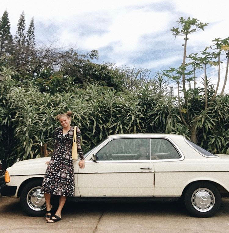 Woman posing on eco-friendly car