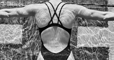 black and white image of woman in a JOLYN one piece swimsuit