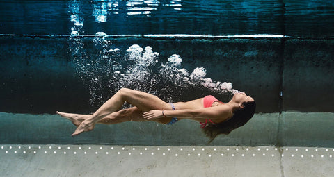 a woman in a JOLYN bikini, underwater