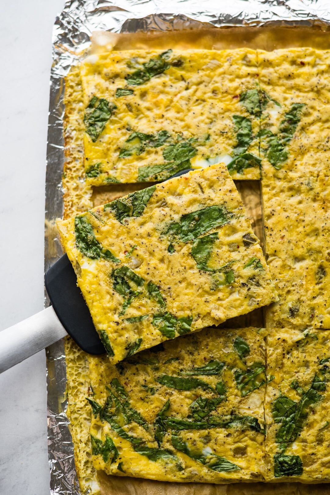 Remove from the oven and allow to cool for 5 minutes before slicing the eggs into 12 squares. | peteandgerrys.com