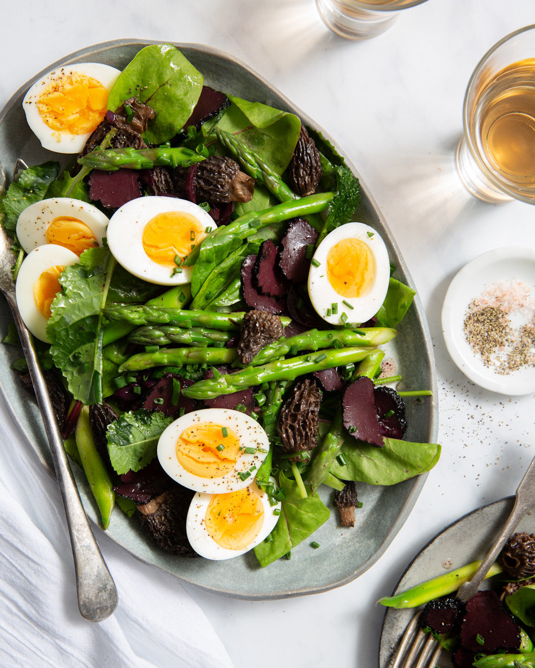 An earthy homemade salad recipe featuring hard-boiled eggs, asparagus, morel mushrooms, and a black truffle vinaigrette. | peteandgerrys.com