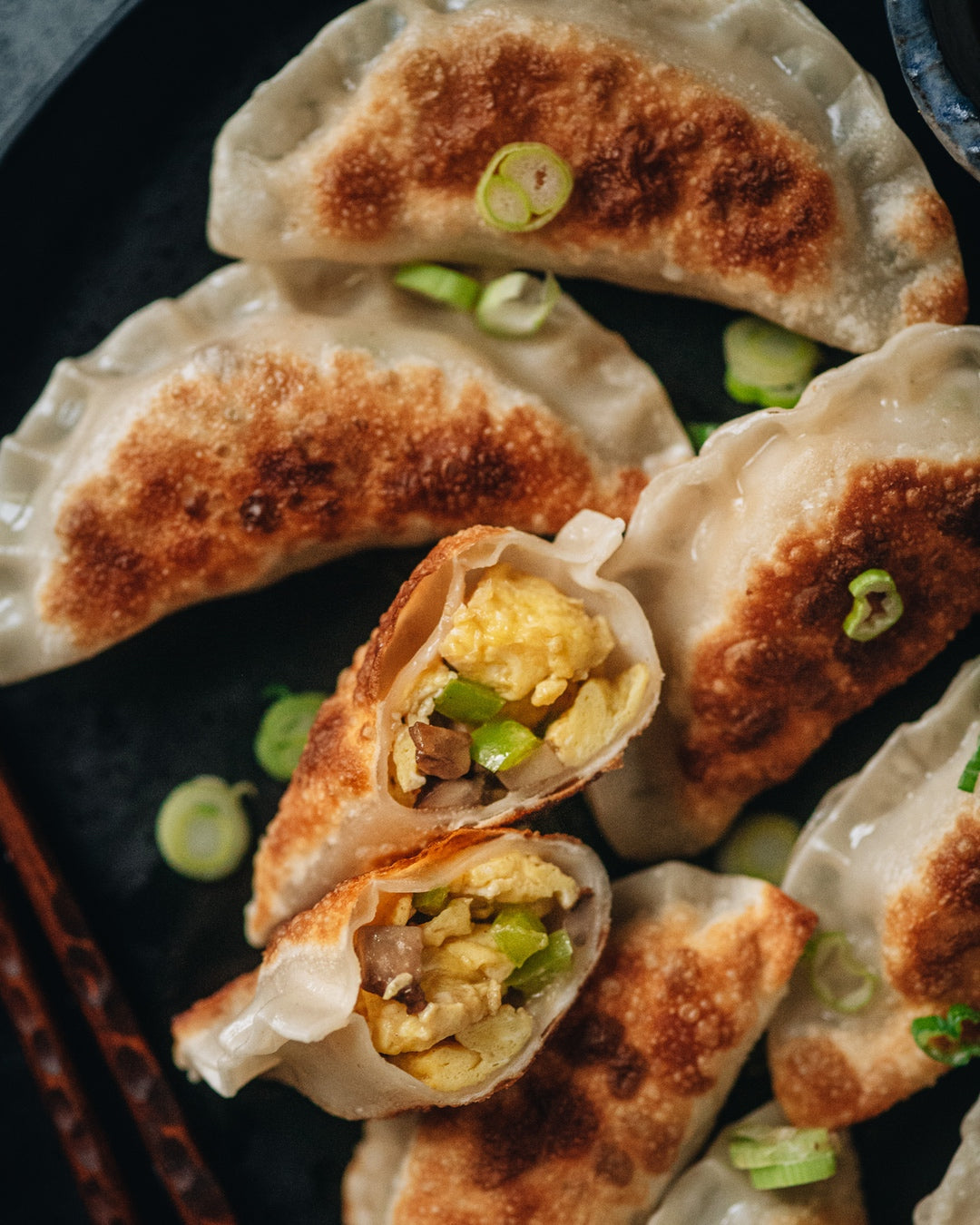 Crispy homemade dumplings made with a vegetarian filling of scrambled eggs, browned mushrooms, and green peppers. | peteandgerrys.com