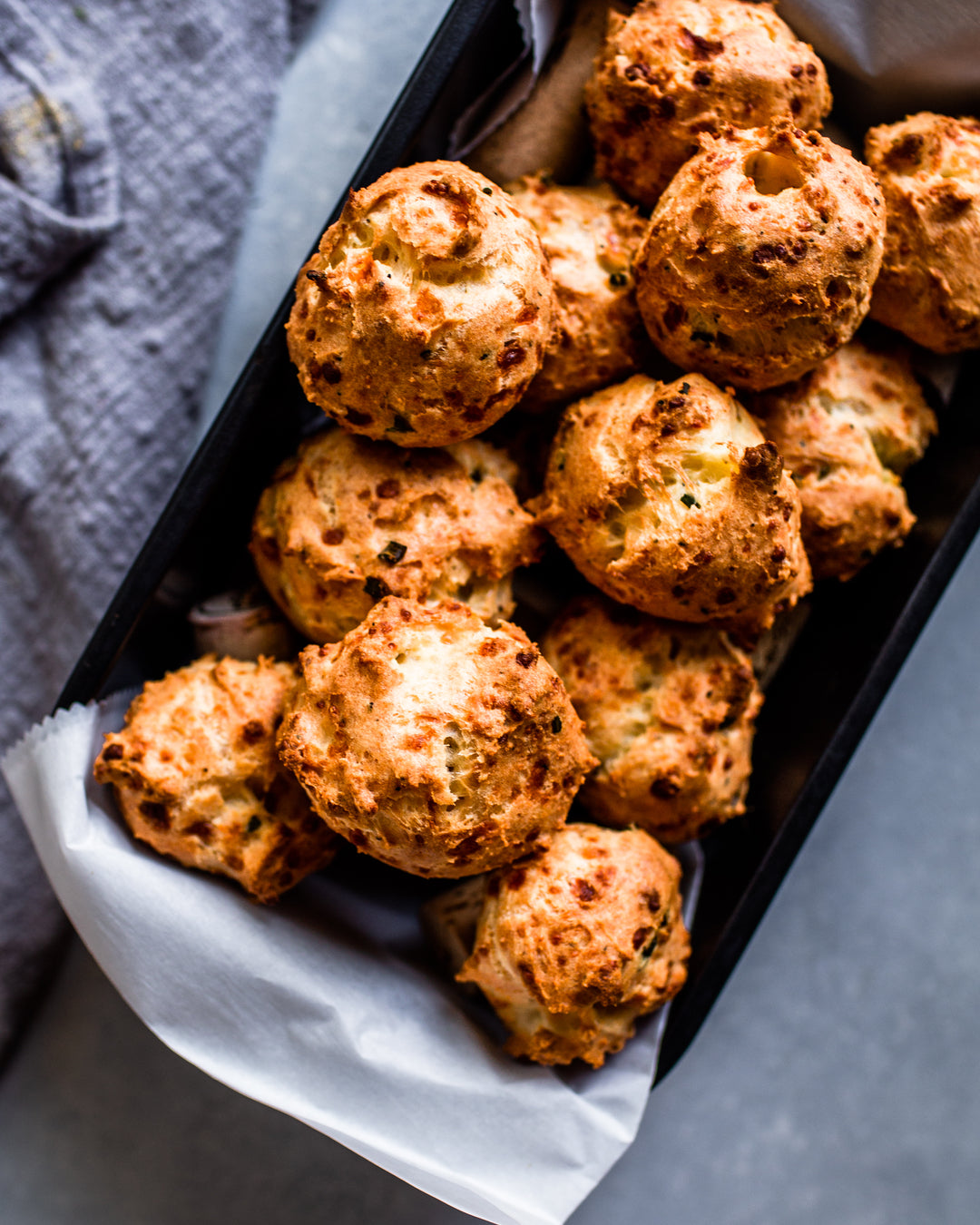 An elevated appetizer recipe for French-style asiago gougères that delivers light, airy cheese balls with a satisfying crunch. | peteandgerrys.com