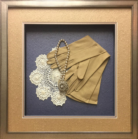framed gloves, and pearl necklace
