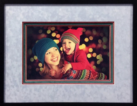 framed photo of a woman and child in beanies, with layered mattes around