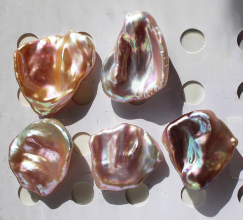 Avariety of keshi pearls, peach, pink and lavender colored