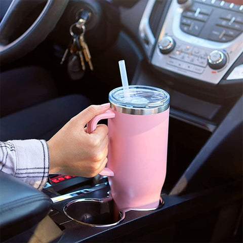 Pink EverTherm™ 40oz Insulated Travel Mug in a car cup holder, designed for spill-proof, temperature-retained hydration on the go.