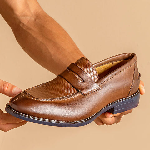 The image features a man holding a male Penny Loafer Sandro Moscoloni