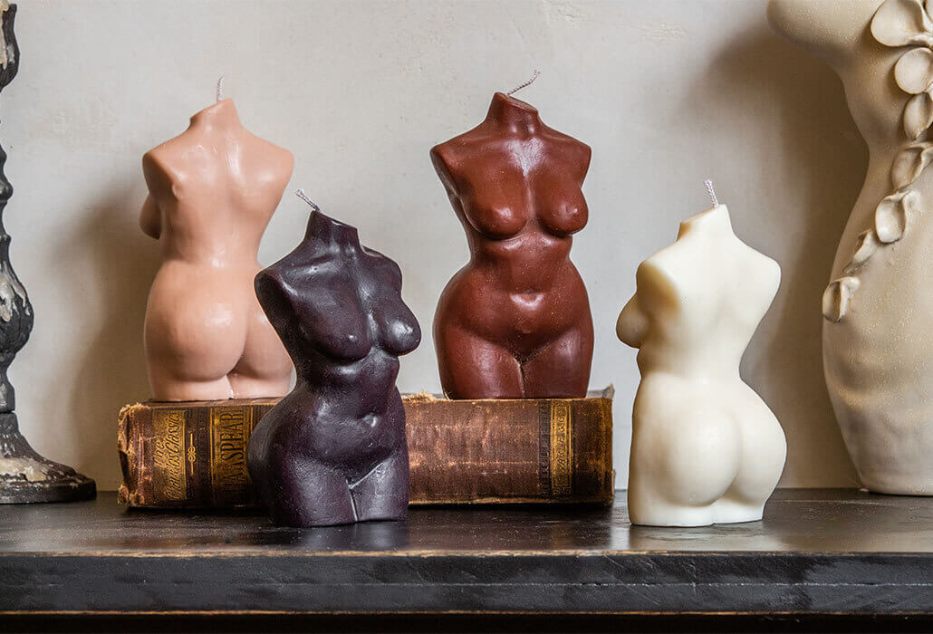 Image of four curvy lady candles.