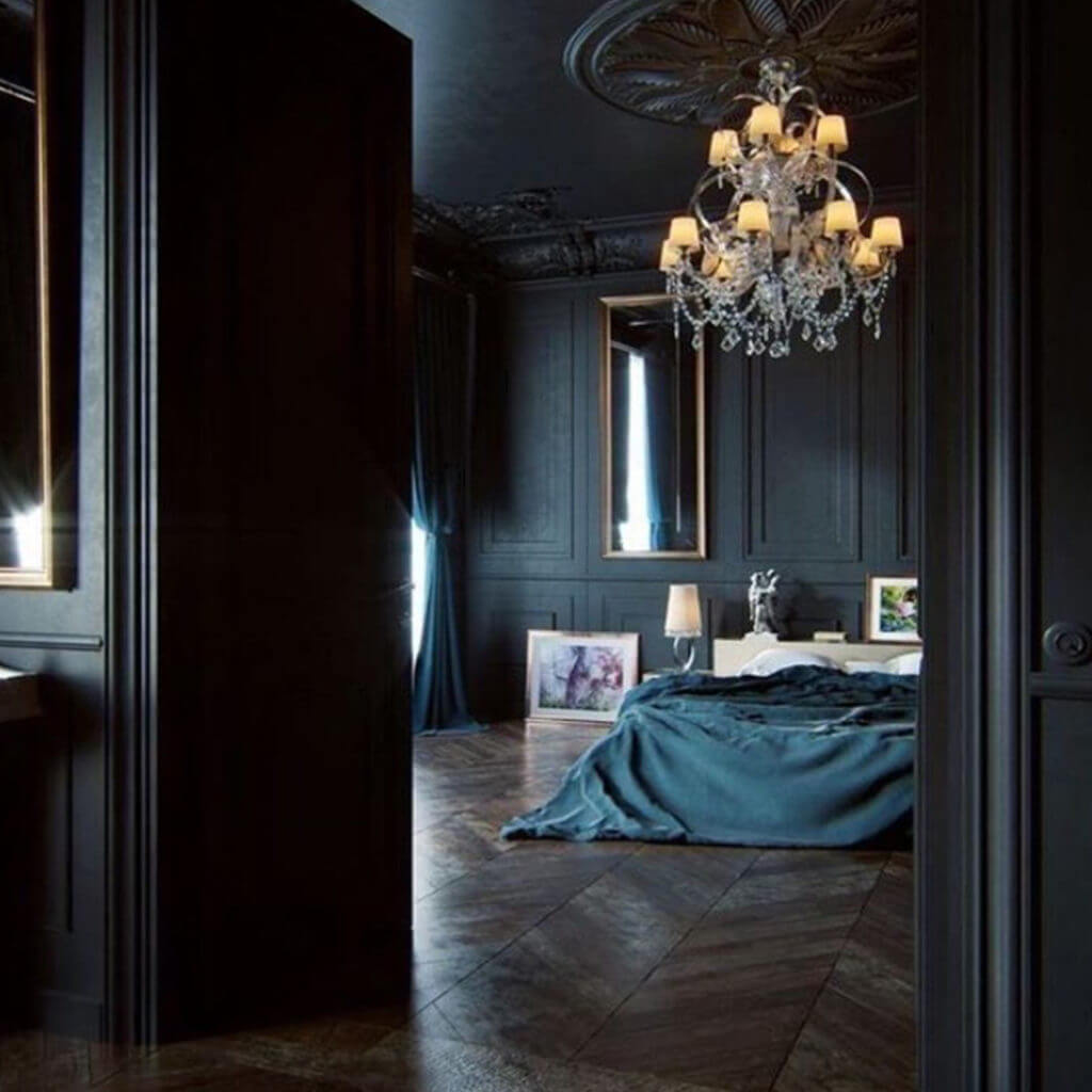 dark walls in bedroom with chandelier