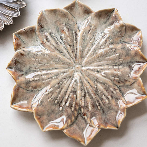 Lifestyle image of the Large Lotus Flower Trinket Dish displayed on a white table with the Cocoa Lotus Flower Trinket Dish.