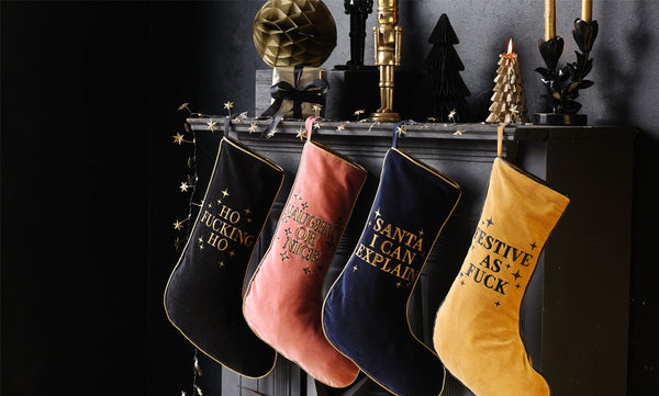 A beautiful fireplace with velvet Christmas stockings