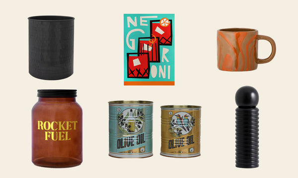 Christmas gift ideas for him including a Negroni print, orange marble mug, disco ball wine cooler, olive oil storage tins, a coffee jar and pepper grinder.