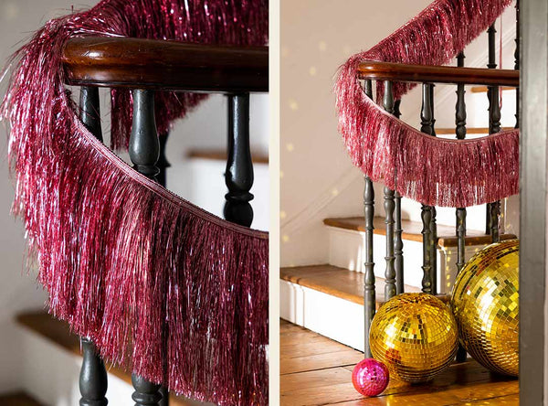 two images of a pink tassel garland wrapped around stair bannisters.