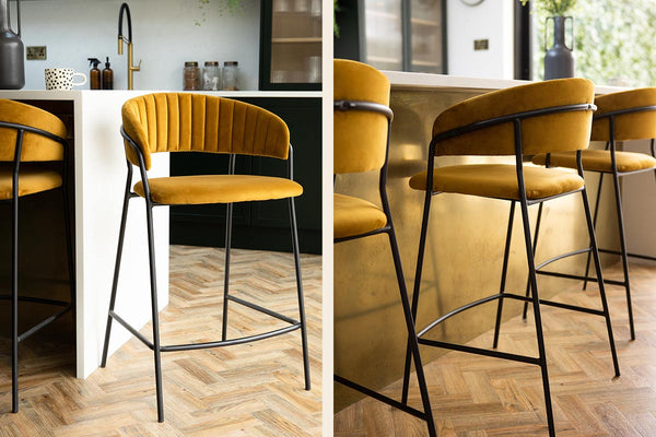 Mustard Bar stools under a gold kitchen island