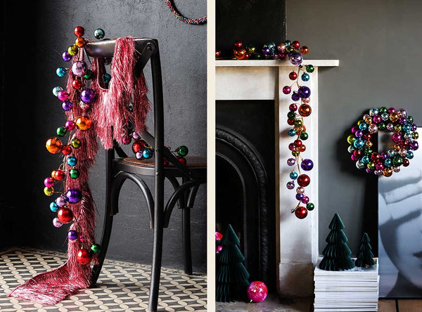 bauble garland drapped from a fireplace and dining chair.