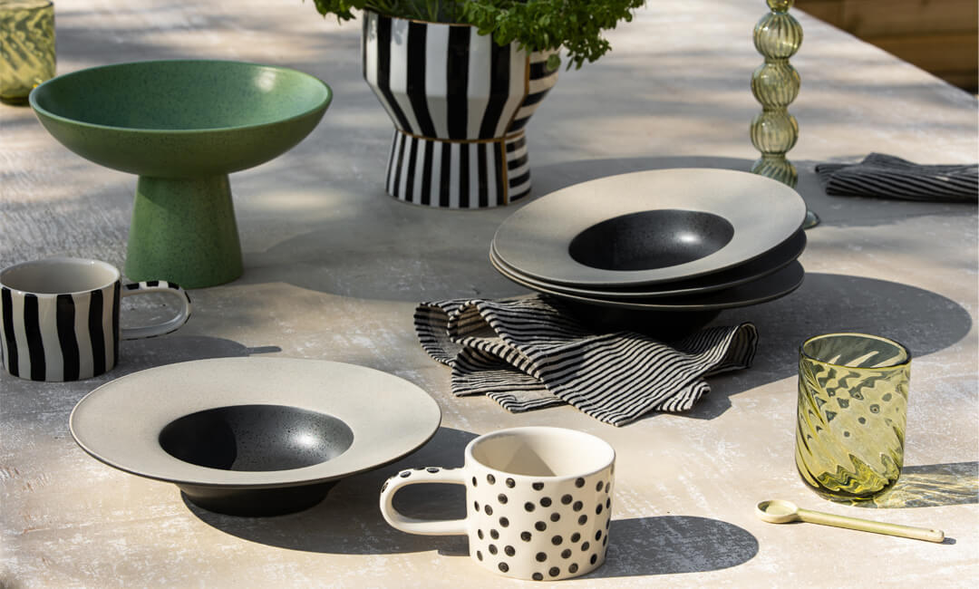 monochrome tableware and kitchen accessories on a table