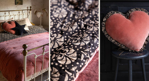 Images showing a pink velvet bed quilt throw with a reversible block printed cotton fabric and a heart shaped cushion with matching block printed ruffled edges.