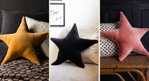 Three images showing star cushions in black, yellow gold or vintage pink velvet, all styled on the bed.