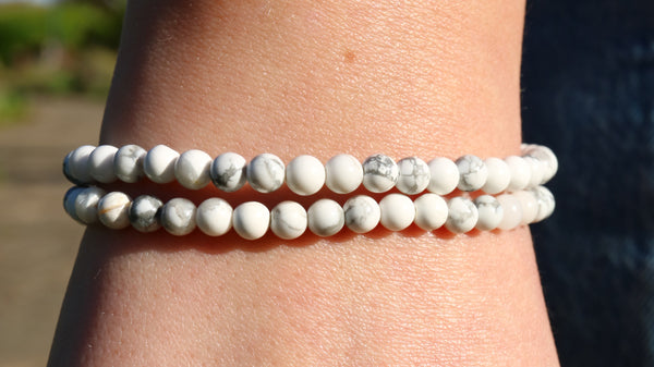Two Howlite Crystal bead bracelets worn on a wrist