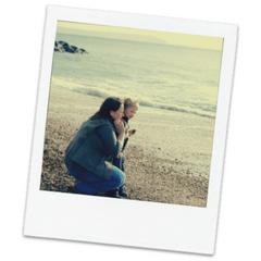 Polaroid of Mel and her son on the beach when they were younger