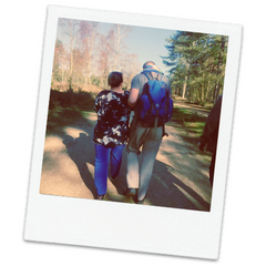 Polaroid of Mel with her grown up son walking together down a path 