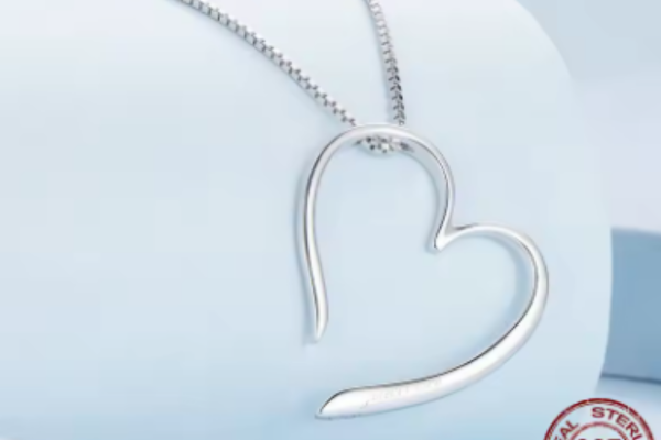 Eternal Grace Heart Necklace featuring a sleek, modern heart-shaped pendant on a delicate chain, perfect for gifts and expressing love.