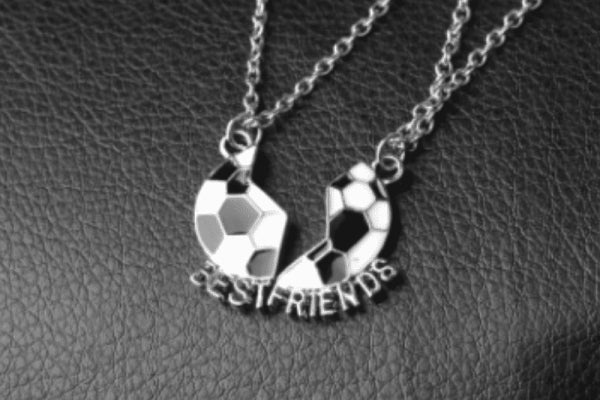 Kickin’ It Together BFF Necklace featuring two interlocking soccer ball pendants with