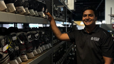 Kevin showing rows of used hockey skates at Skater’s Edge Source for Sports in Sudbury.