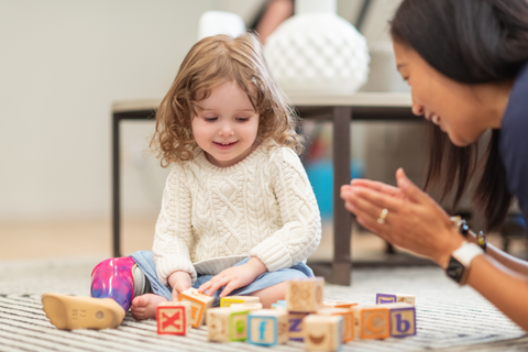 girl playing with blocks